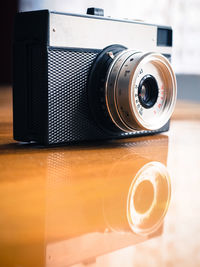 Close-up of camera on table