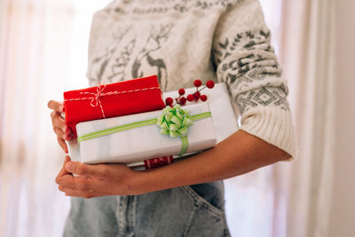 Midsection of woman holding wrapped in box