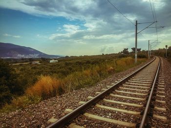 Railroad tracks against sky