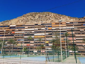 Low angle view of building against clear blue sky