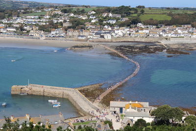 High angle view of cityscape by sea