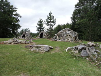 Rocks on field against sky