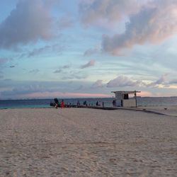 Scenic view of sea against cloudy sky