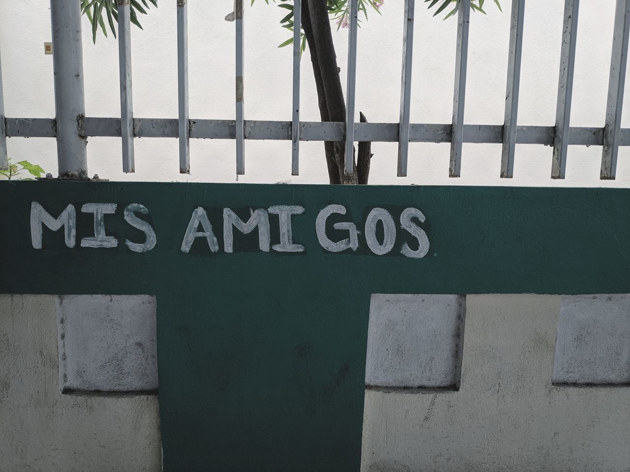 CLOSE-UP OF TEXT ON WALL WITH SIGN