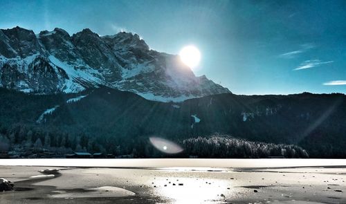 Scenic view of snow mountains against sky