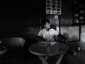 Young man sitting in restaurant
