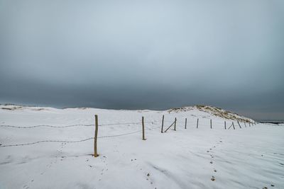 Scenic view of sea against sky during winter