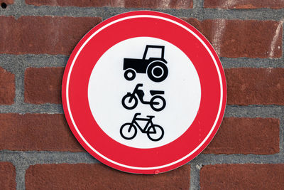 Close-up of road sign on wall