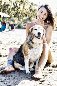 Portrait of young woman with dog