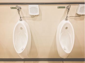 High angle view of urinals in bathroom