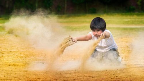 Boy playing in sand