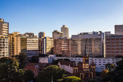 Modern buildings against clear sky