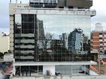 Reflection of buildings on glass window