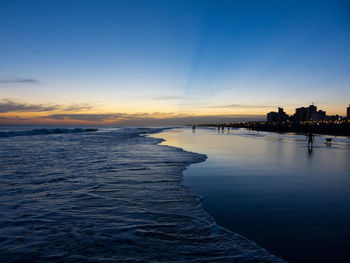 Scenic view of sea against sky at sunset