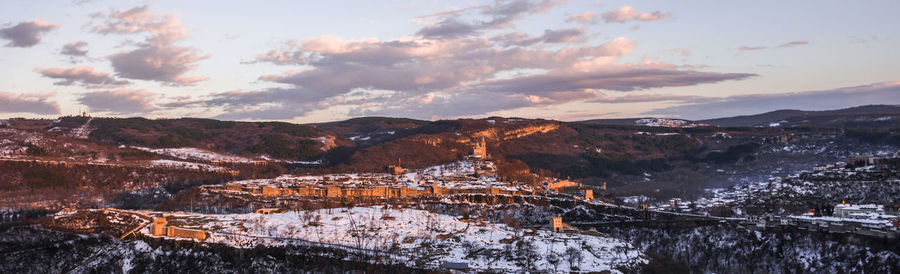 Panoramic view of mountains against sky during sunset