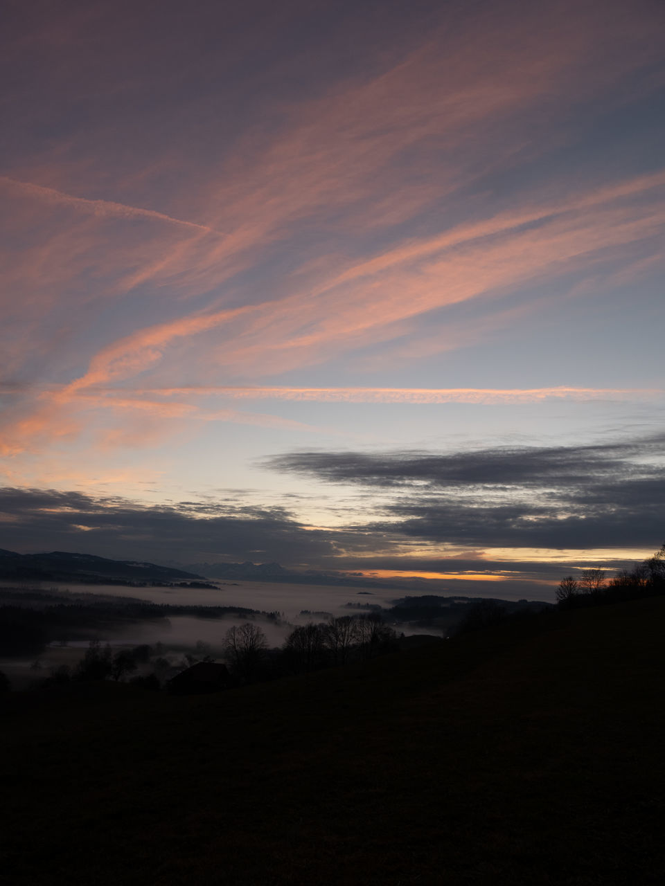 SCENIC VIEW OF SILHOUETTE LANDSCAPE AGAINST DRAMATIC SKY