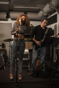 Musicians rehearsing in a recording studio