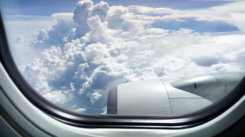 Aerial view of cloudscape seen from airplane window