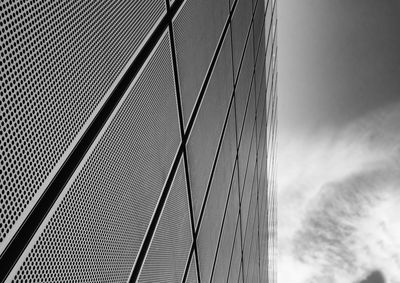 Low angle view of suspension bridge against sky