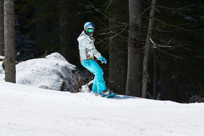 Full length of person on snow covered land