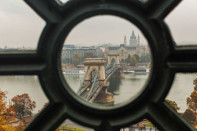 Chain bridge and st stephens cathedral view through round fence