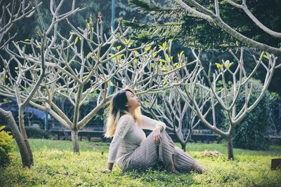 Woman sitting on grass