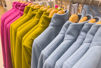 Close-up of clothes hanging in store