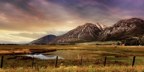 Scenic view of landscape against cloudy sky