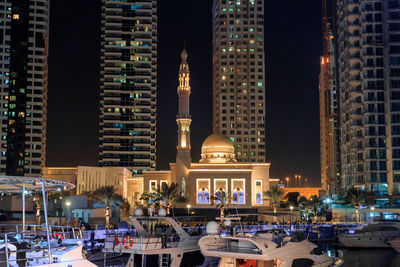 Illuminated buildings in city at night