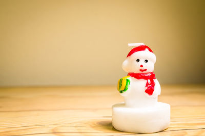 Close-up of creative candle on table during christmas