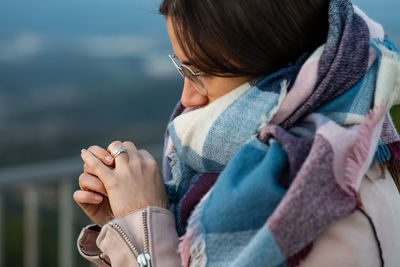 Close-up portrait of woman in winter