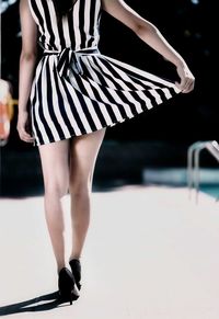 Low section of woman standing outdoors