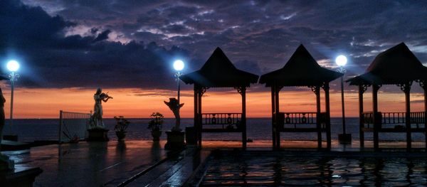 View of illuminated street lights at night