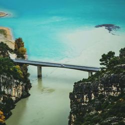 Bridge over sea against sky