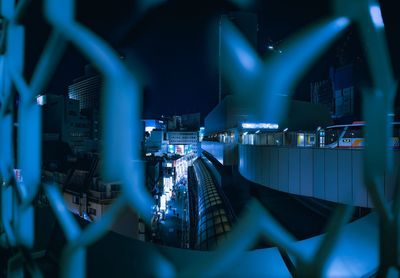 Illuminated modern buildings in city at night