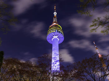 Low angle view of illuminated building against sky