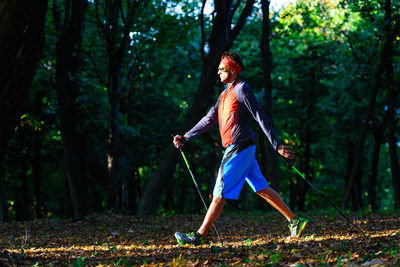 Side view of woman in the forest