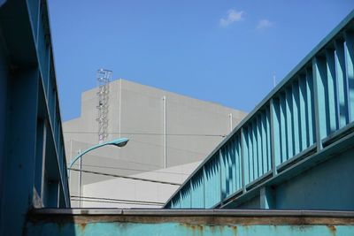 Low angle view of building against clear blue sky