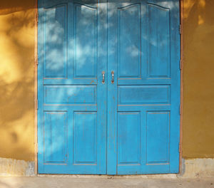 Closed blue door of building