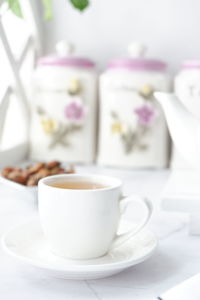 Close-up of coffee cup on table