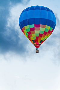 Low angle view of hot air balloon flying in sky