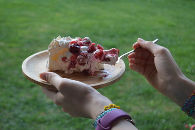 Midsection of woman holding ice cream