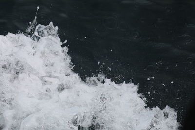 High angle view of water splashing in sea