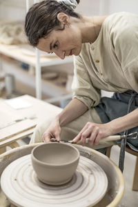 Close-up of man working at workshop