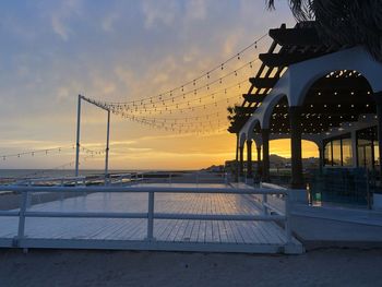 Bridge over sea during sunset