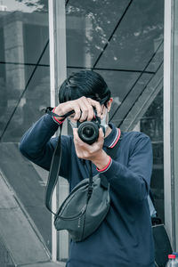 Portrait of man photographing