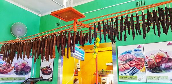 Multi colored flags hanging for sale at market stall