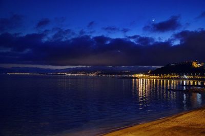 Scenic view of sea against sky at night