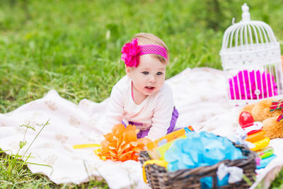 Cute baby girl with pink flower