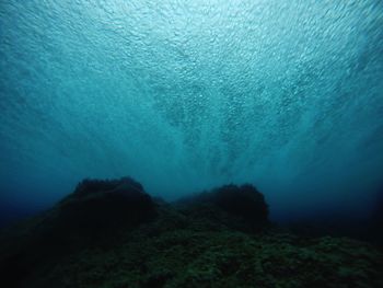 Scenic view of sea and rocks underwater 